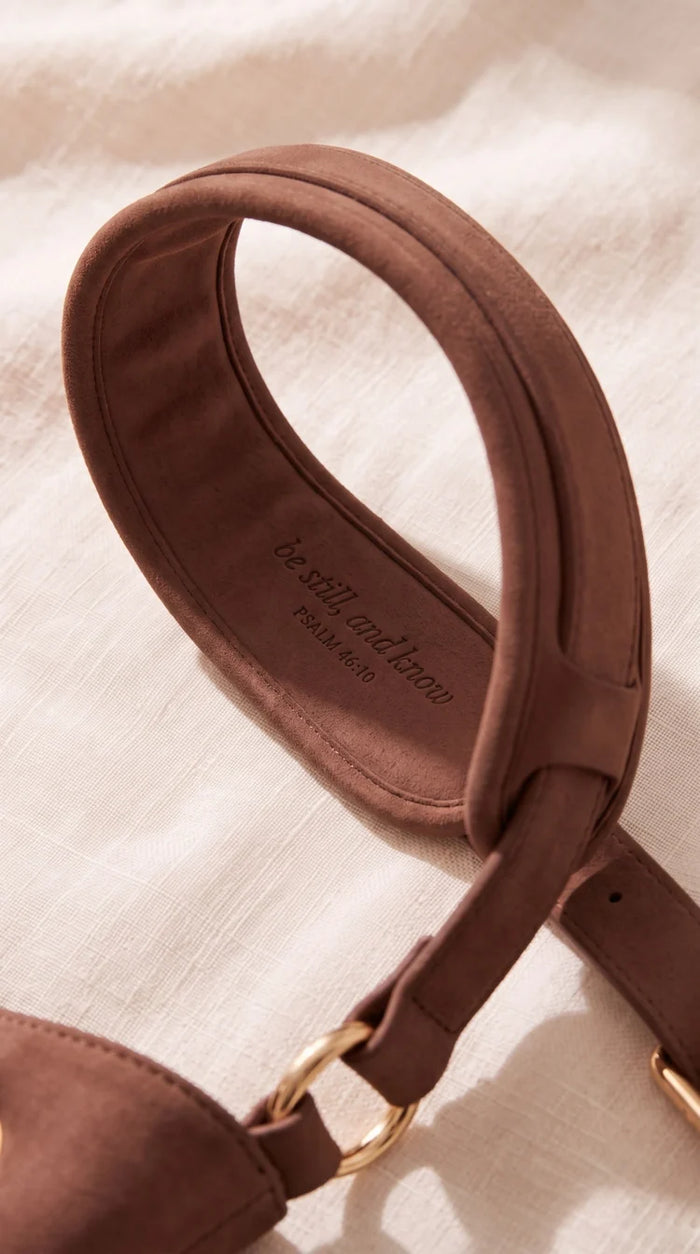 Be still and know — Psalm 46:10 inscription under shoulder strap