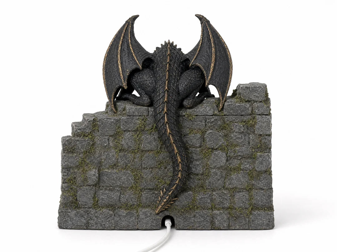 Back of dragon display showing wings tail and castle stonework