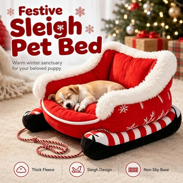 Red Christmas sleigh pet bed with a sleeping puppy