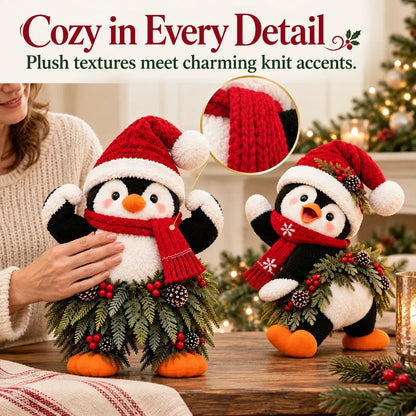 Weihnachtliche Pinguin-Willkommensdekoration mit Weihnachtsmütze und festlichem Grün