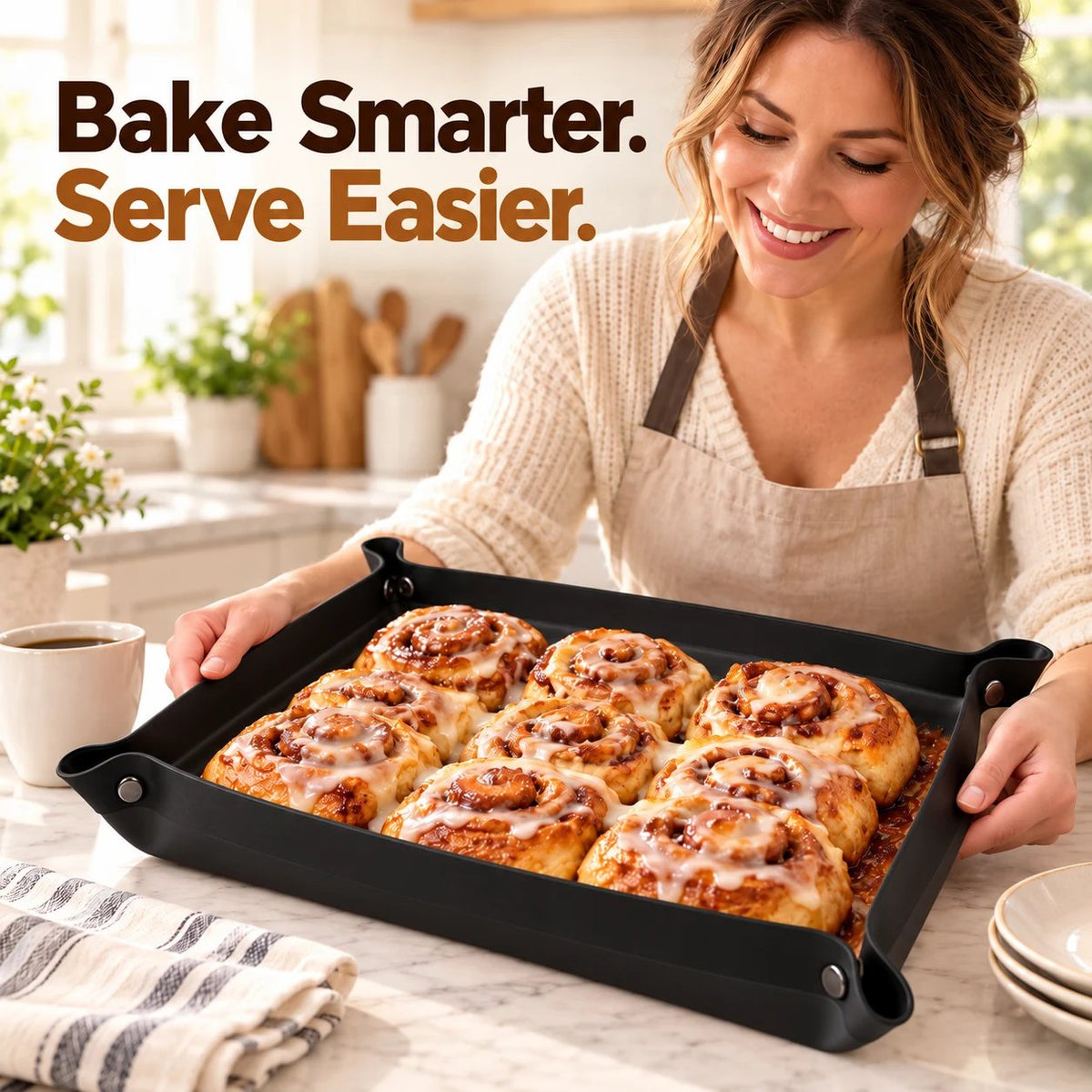 Foldable black corner-snap baking tray filled with homemade cinnamon rolls