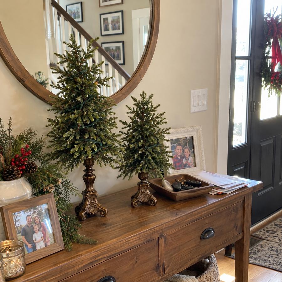 Vintage Christmas trees on an entryway console