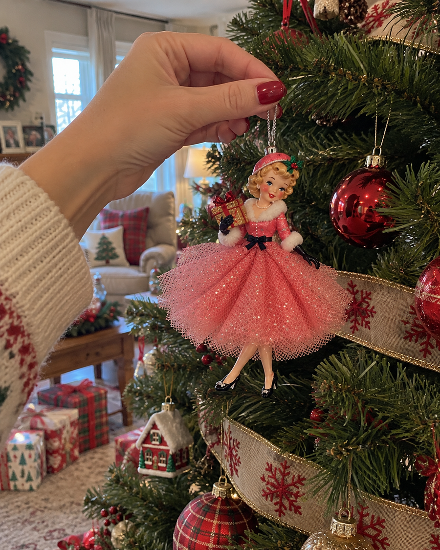 Pink vintage girl ornament held against a Christmas tree for visual scale