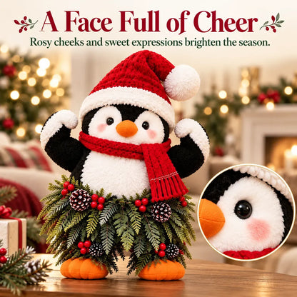 Weihnachtliche Pinguin-Willkommensdekoration mit Weihnachtsmütze und festlichem Grün
