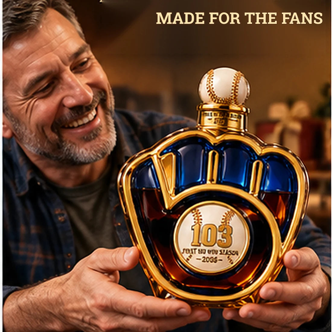 Smiling mature baseball fan holding the blue and gold commemorative bottle in a cozy room