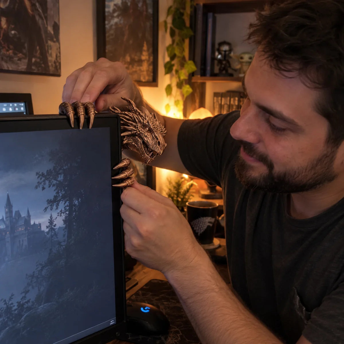 Bronze dragon monitor buddy being placed onto a computer by a man