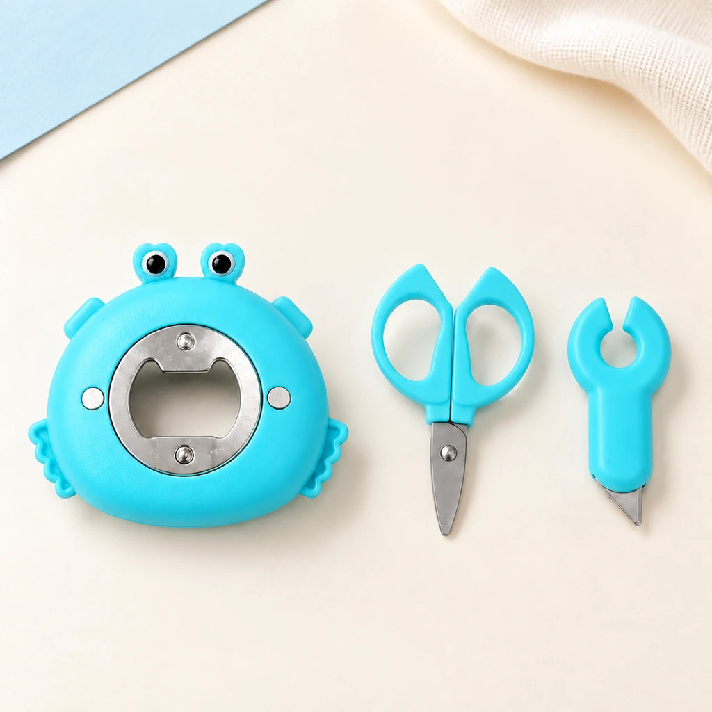 The crab body with its rear bottle opener beside the removable mini scissors and box opener.