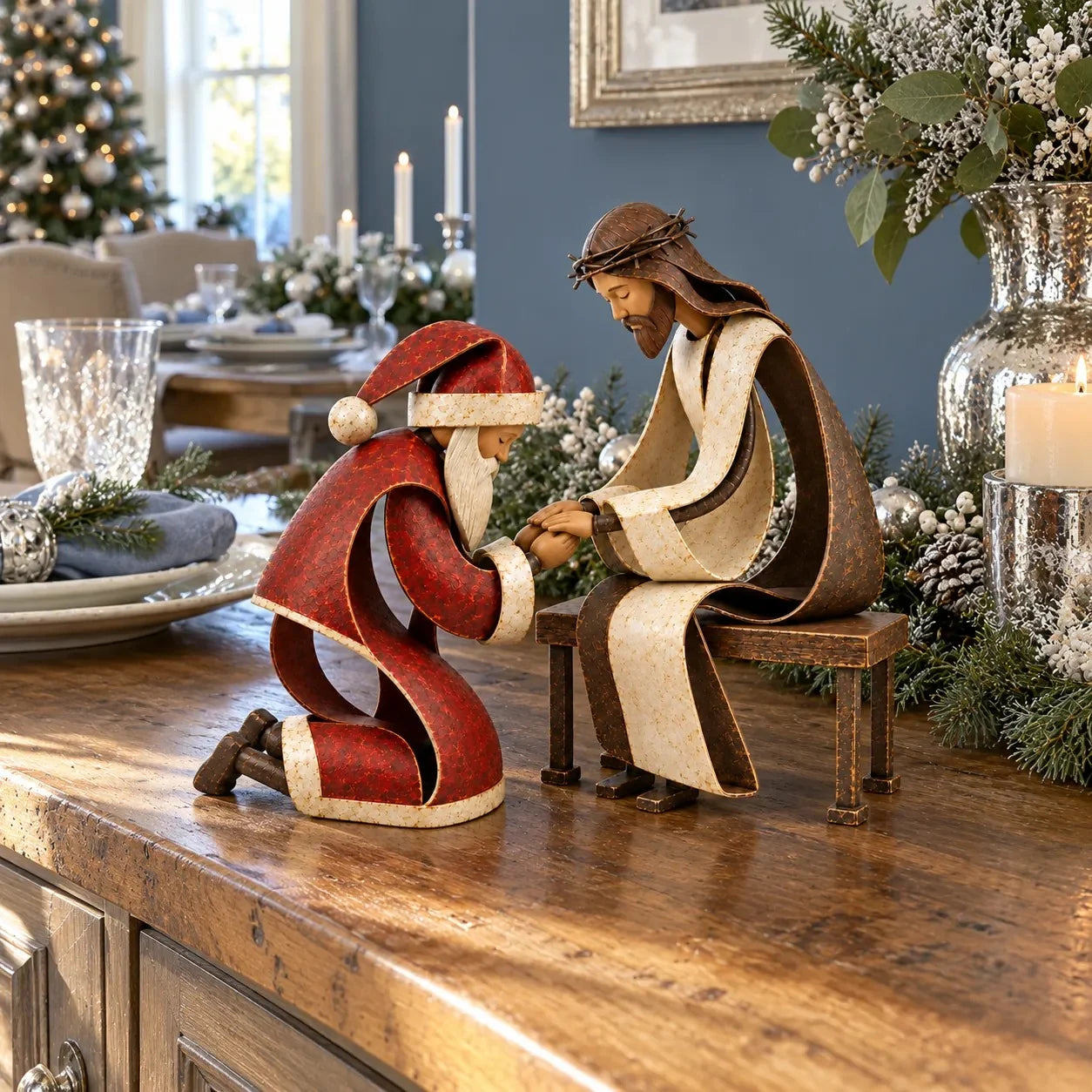 Santa and Jesus figurines displayed on a festive Christmas dining table