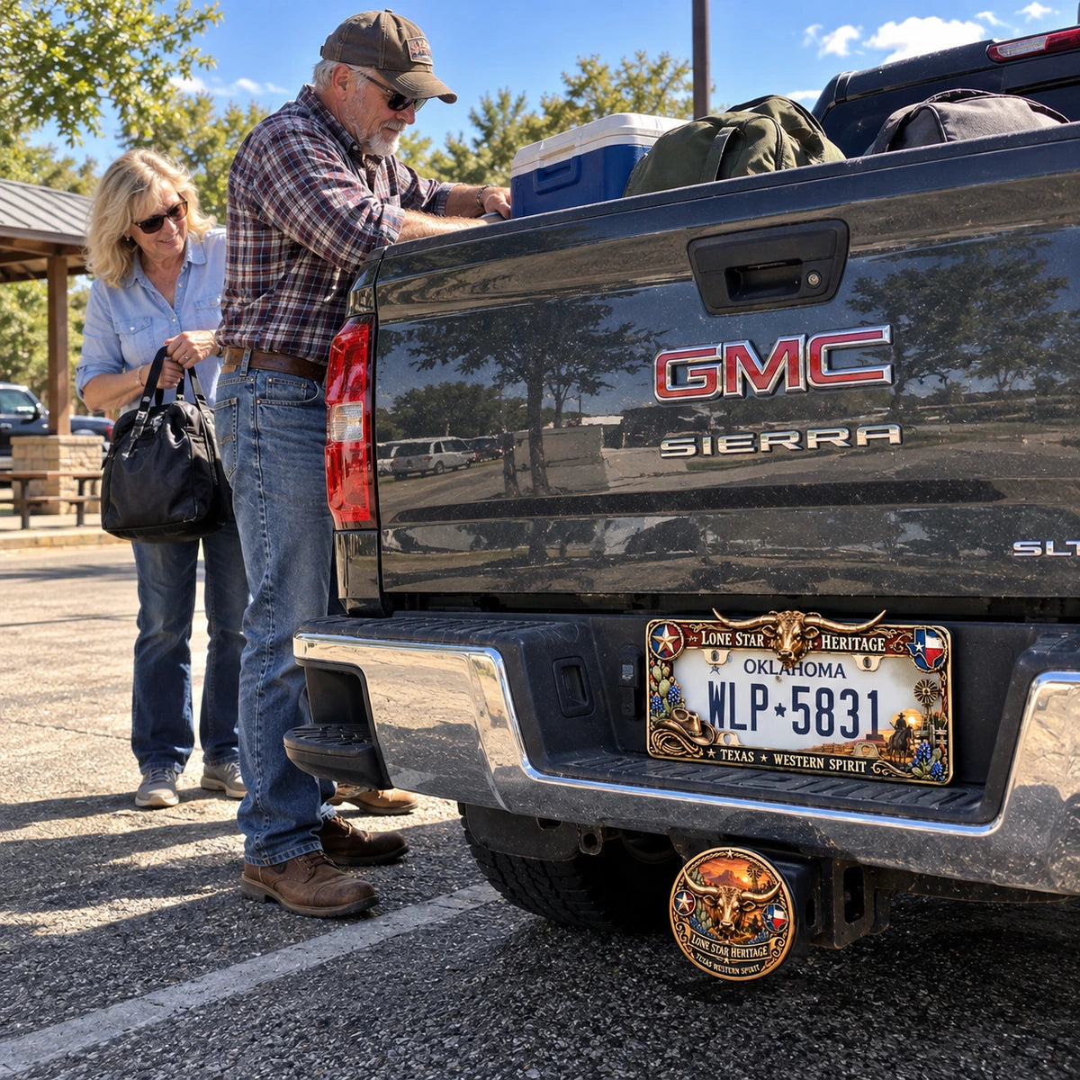 Matching frame and receiver hitch cover on a GMC truck
