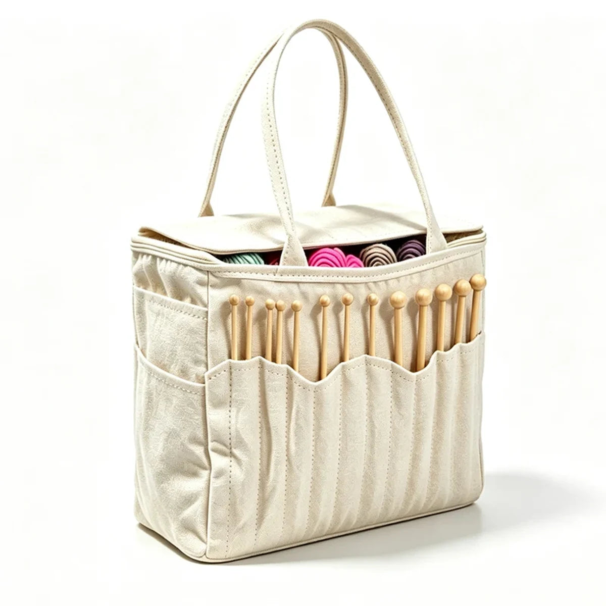Canvas yarn storage bag open with yarn and knitting needles